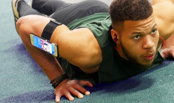 Man exercising with RevereSport armband